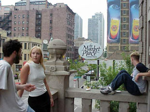 The balcony is a great place to people-watch and observe the thriving neighborhood below. 